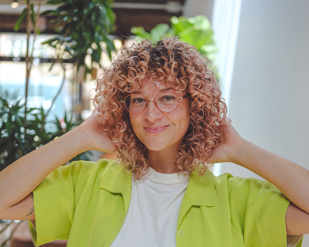 How to Ask Your Hair Stylist for a Curly Haircut with Bangs